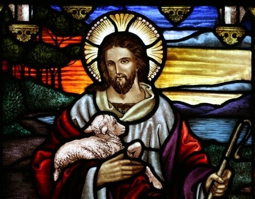 Stained glass image of Jesus holding a lamb