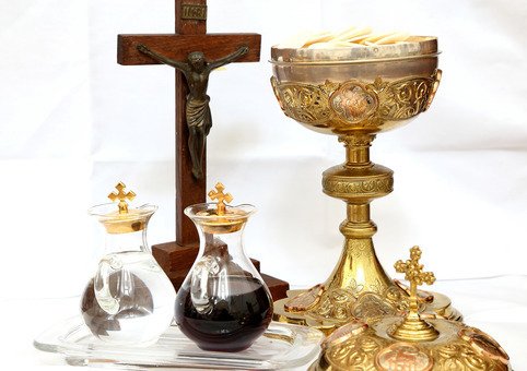 Holy Communion (the chalice and vials of water and wine)  and Jesus on the Cross.